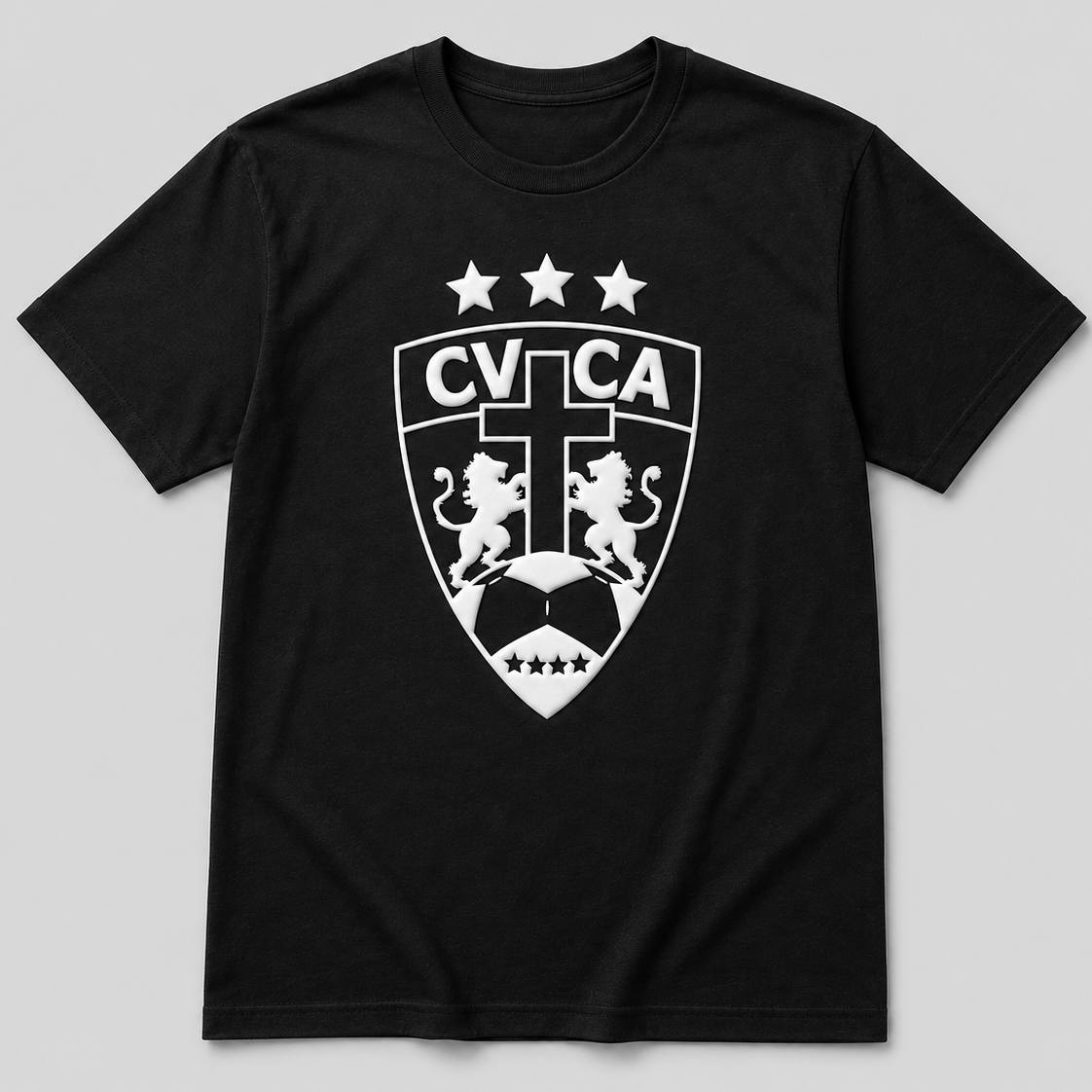 A black short-sleeve crewneck t-shirt featuring a white printed CVTCA shield crest with lions, stars, and a soccer ball on the front, displayed against a neutral gray background.