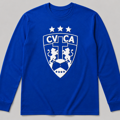 A royal blue long-sleeve t-shirt with a white printed CVCA shield crest on the chest, displayed against a neutral gray background.