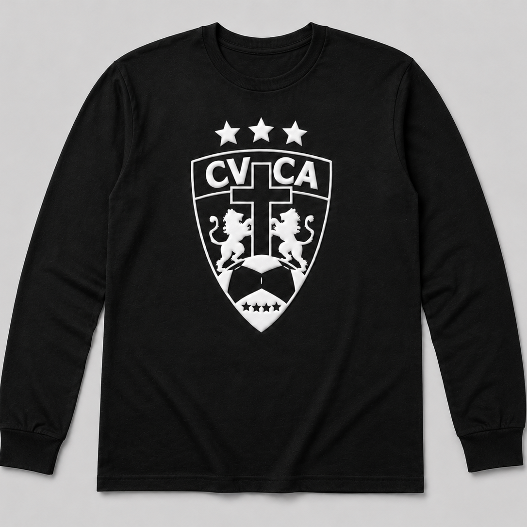 A black long-sleeve t-shirt with a white printed CVCA shield crest featuring lions, a soccer ball, and three stars on the chest, displayed against a neutral gray background.